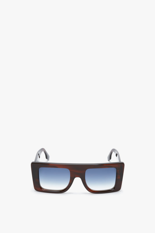 A pair of Oversized Frame Sunglasses In Brown Horn by Victoria Beckham, positioned against a white background.