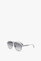 A pair of V Metal Pilot Sunglasses In Grey Gradient by Victoria Beckham is placed on a white background, featuring gunmetal grey gradient accents.