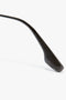 Close-up of the black temple arm of a pair of eyeglasses, showcasing its sleek design and textured pattern reminiscent of gunmetal grey gradient, akin to Victoria Beckham's V Metal Pilot Sunglasses In Grey Gradient.