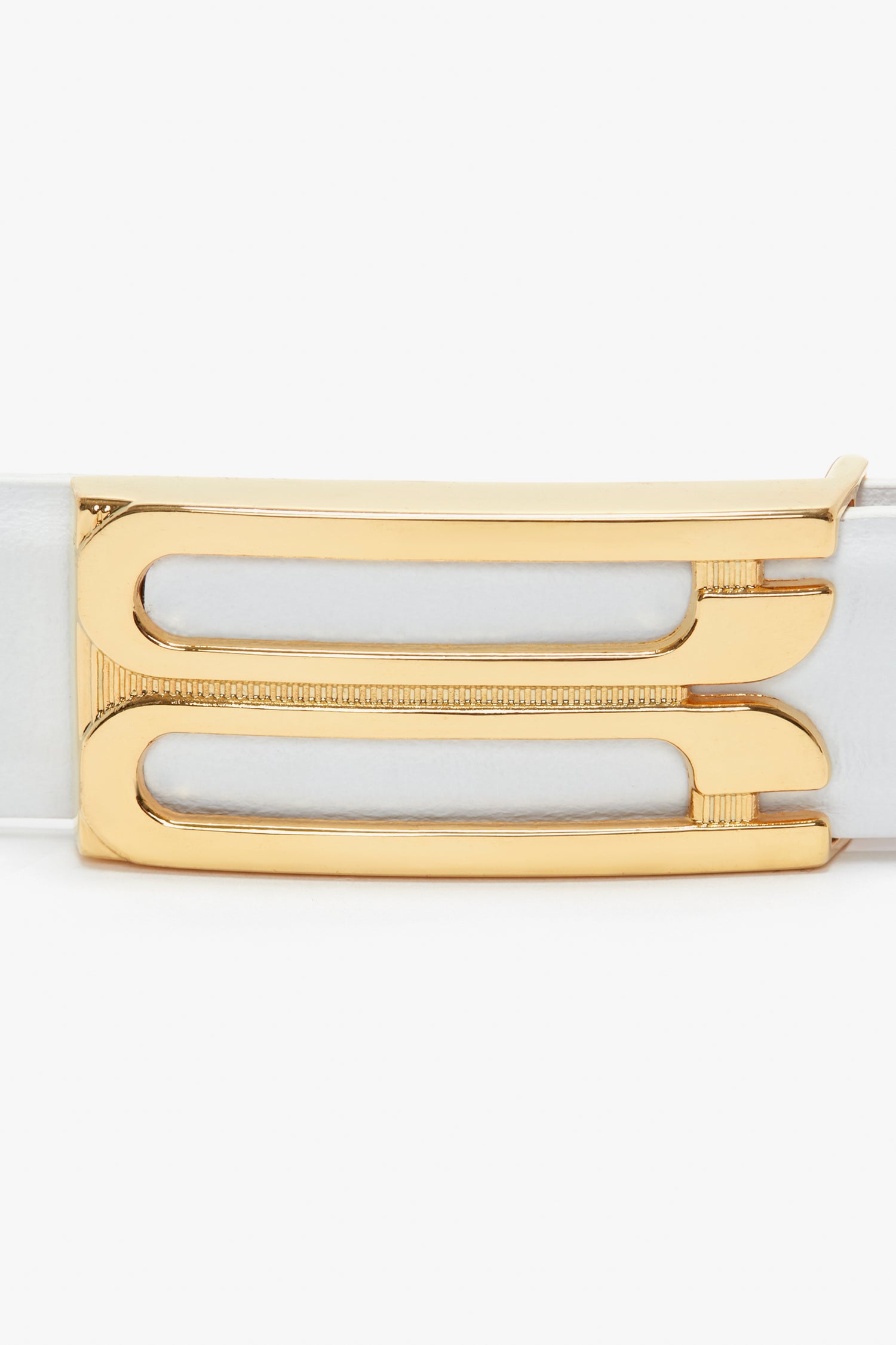 Close-up of a Frame Belt In White Leather by Victoria Beckham, made from polished white smooth calf leather, featuring a gold metal buckle with two elongated rectangular cutouts.