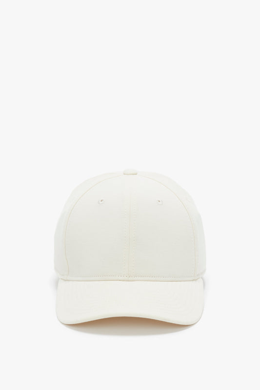 Front view of a Victoria Beckham Antique White Logo Cap on a white background.