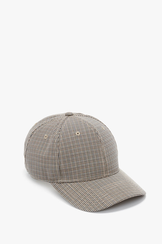 A Victoria Beckham Logo Cap In Dogtooth Check pattern with a curved bill, displayed against a white background.