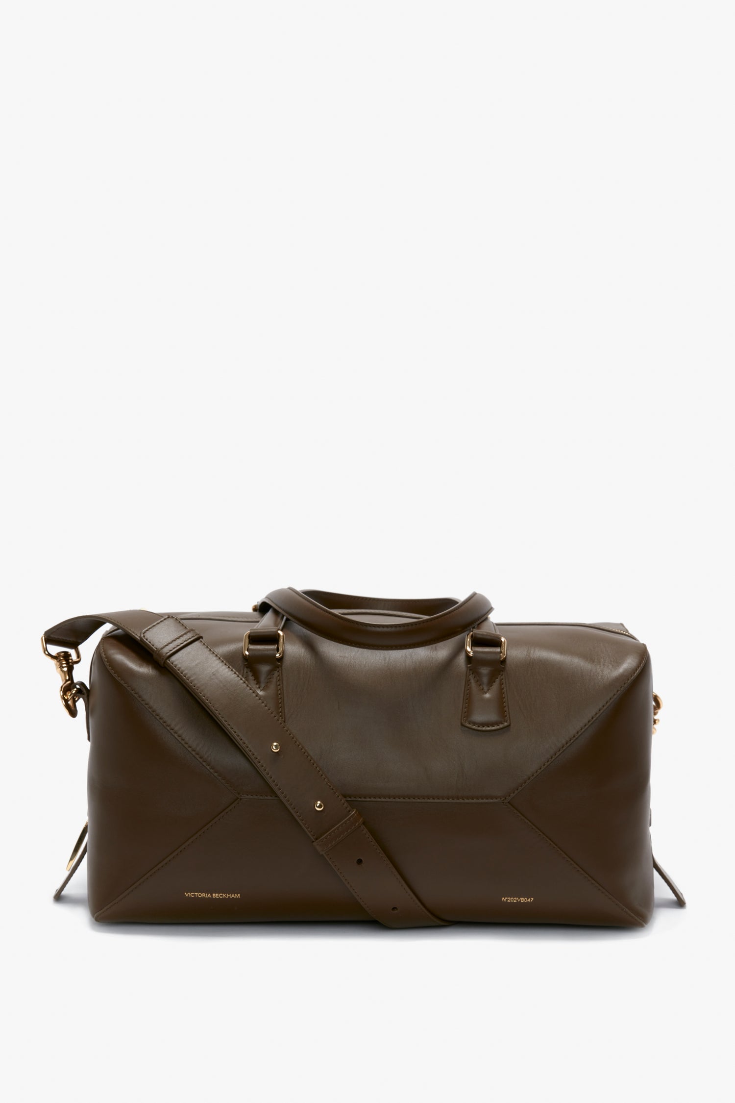 A Medium Gym Bag In Olive with a shoulder strap and gold-tone hardware, featuring subtle branding near the base, reminiscent of a Victoria Beckham design.