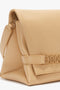 A close-up of a Victoria Beckham Chain Pouch Bag With Strap In Sesame Leather features a top handle, woven strap detail, and an embossed VB logo.