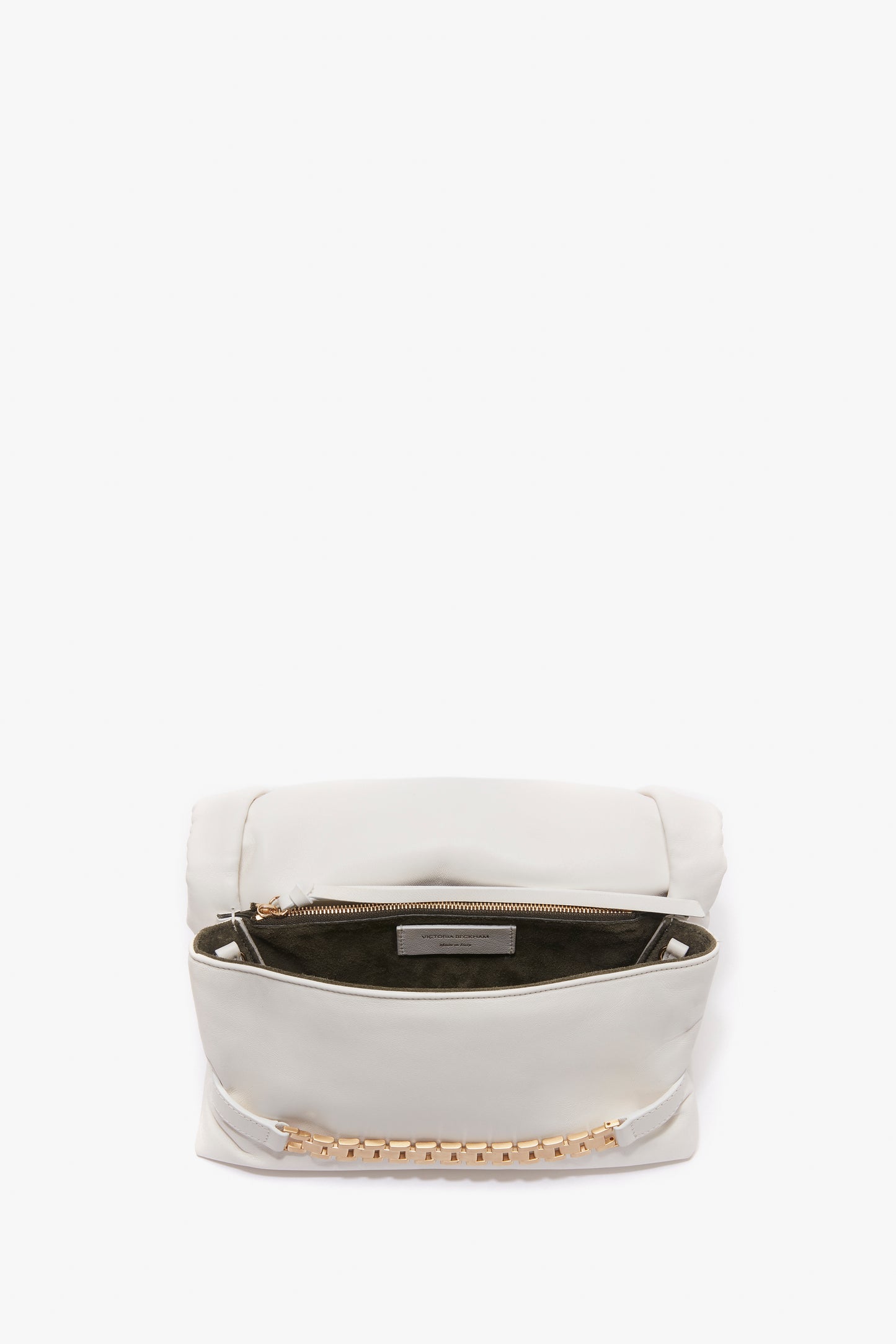 A white Victoria Beckham Puffy Chain Pouch Bag With Strap In White Leather with a gold chain detail and an open top, revealing a zippered compartment and a dark interior. Featuring a detachable shoulder strap, this chic accessory combines style and versatility effortlessly.