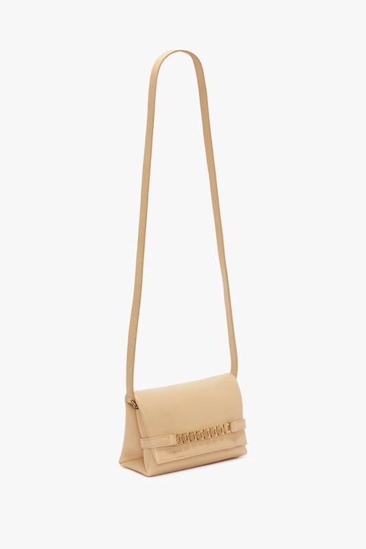 Mini Pouch With Long Strap In Sesame Leather by Victoria Beckham, displayed against a white background.