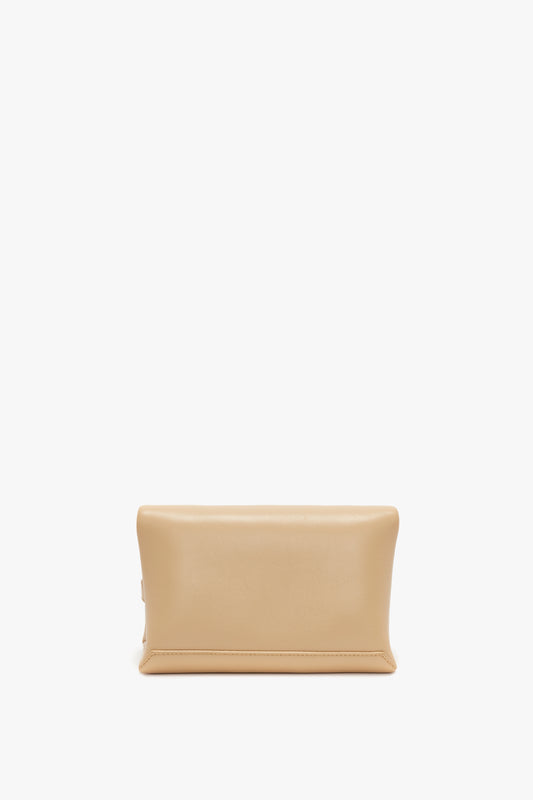 Victoria Beckham's Mini Pouch With Long Strap In Sesame Leather on a white background.