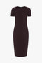 A short-sleeved, dark purple, knee-length Fitted T-Shirt Dress In Deep Mahogany by Victoria Beckham on a plain white background.