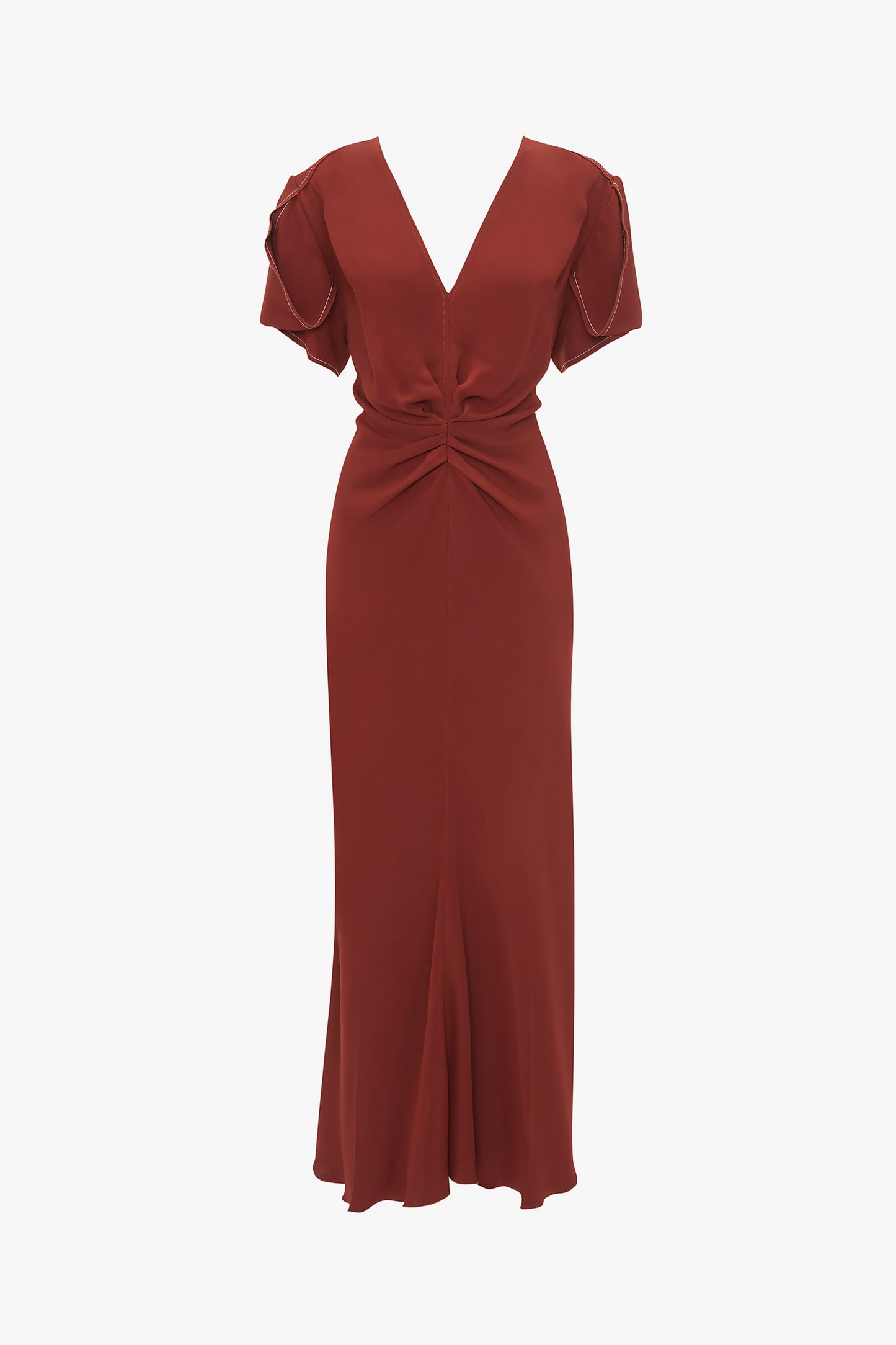 Description: The Gathered V-Neck Midi Dress In Russet by Victoria Beckham is a long, deep red dress with short, puffy sleeves, a gathered V-neck, and a waist-defining pleat detail at the waist, displayed on a plain white background.