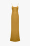 A full-length, sleeveless, Low Back Cami Floor-Length Dress In Harvest Gold by Victoria Beckham in crepe back satin with thin spaghetti straps and a fitted silhouette.