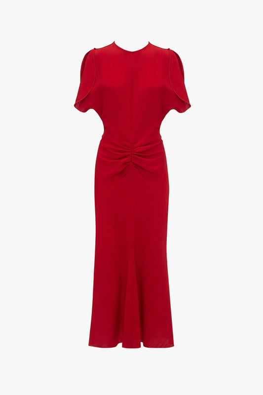 A red, short-sleeve, knee-length dress with a round neckline and a gathered knot detail at the waist, reminiscent of the Exclusive Gathered Waist Midi Dress In Carmine by Victoria Beckham.