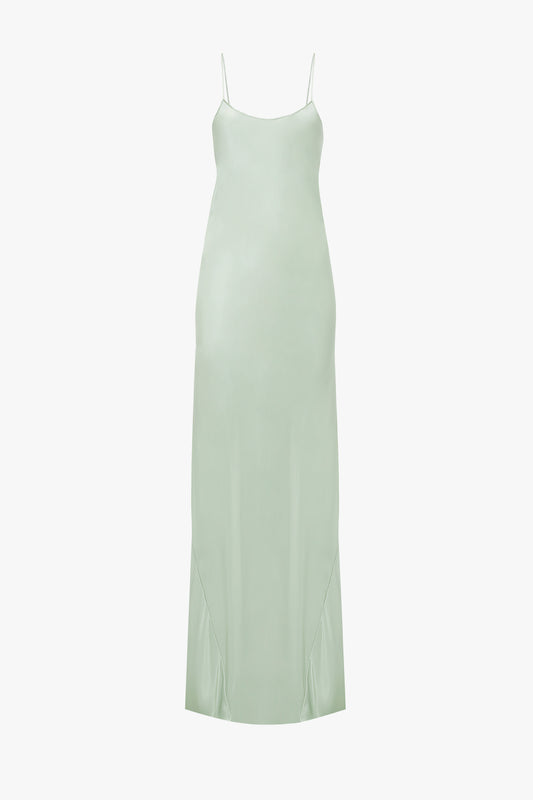 A jade green Exclusive Low Back Cami Floor-Length Dress by Victoria Beckham with thin straps and a midi-length cut, displayed against a white background.