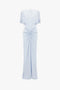 Exclusive Floor-Length Gathered Dress In Ice by Victoria Beckham featuring a waist-defining silhouette, short sleeves, and sensuous open back showcasing ruched detail at the waist.