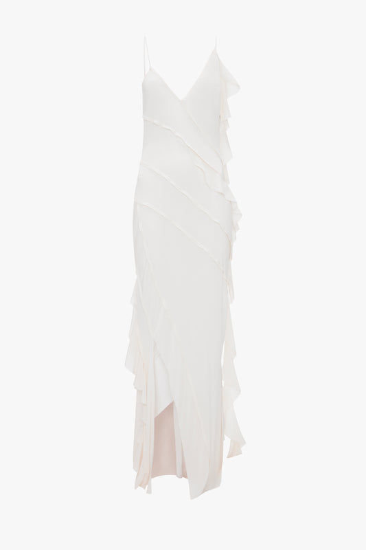 An elegant white Exclusive Asymmetric Bias Frill Dress In Ivory with layered ruffle details, displayed on a mannequin against a white background by Victoria Beckham.
