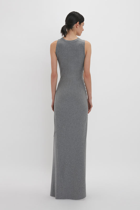 Person wearing a Victoria Beckham Frame Detailed Maxi Dress In Titanium, standing with their back to the camera against a white background.
