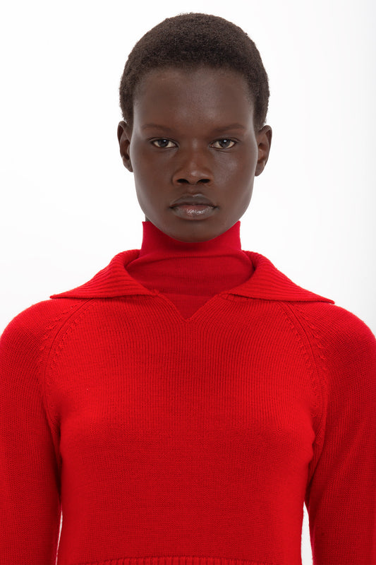 A person wearing a Victoria Beckham Double Layer Top In Deep Red looks directly at the camera against a white background.