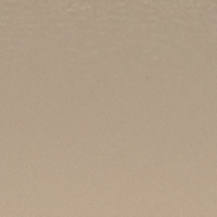 A close-up of a blank beige surface with a subtle texture, reminiscent of the structured design seen in Victoria Beckham's Victoria Crossbody Bag In Taupe Leather.
