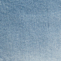 Close-up view of light blue vintage denim fabric with a diagonal weave pattern, reminiscent of the Alina High Waisted Jean In Light Summer Wash designed by Victoria Beckham.