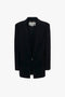 A Peak Lapel Jacket In Midnight by Victoria Beckham with a notched lapel, front pockets, uncut buttonhole detailing, and a single-button closure.