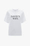 White 'David's Wife' slogan T-shirt made of organic cotton with the phrase printed in black font on the chest by Victoria Beckham.