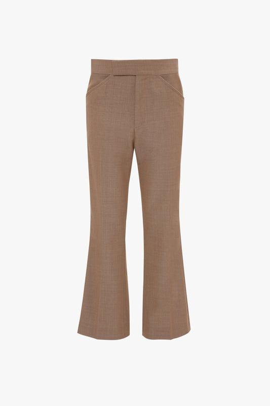 Wide Cropped Flare Trouser In Tobacco by Victoria Beckham, reminiscent of 1970s-inspired trousers. The pants have a waistband and no visible pockets or embellishments, offering a contemporary kick hem. They are set against a solid white background.
