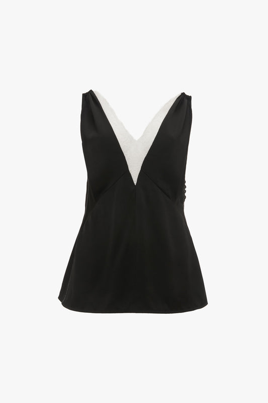 Lace Detail Cami Top In Black by Victoria Beckham with a deep V-neckline featuring a white accent along the edges, crafted from luxurious crepe back satin.