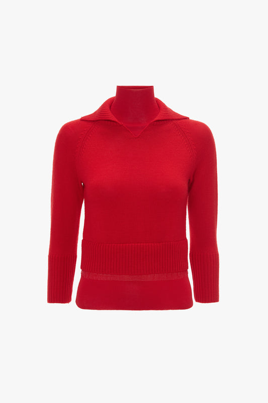 Red long-sleeve **Double Layer Top In Deep Red** with a V-neck collar and ribbed hem and cuffs, crafted from merino wool knit, displayed on a featureless stand by **Victoria Beckham**.