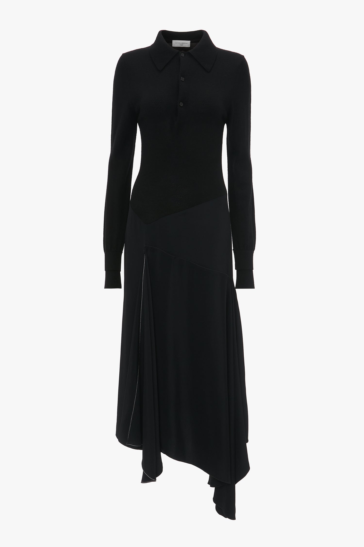 A Victoria Beckham Henley Shirt Dress In Black with a collared neckline, buttoned front, and asymmetrical hemline.