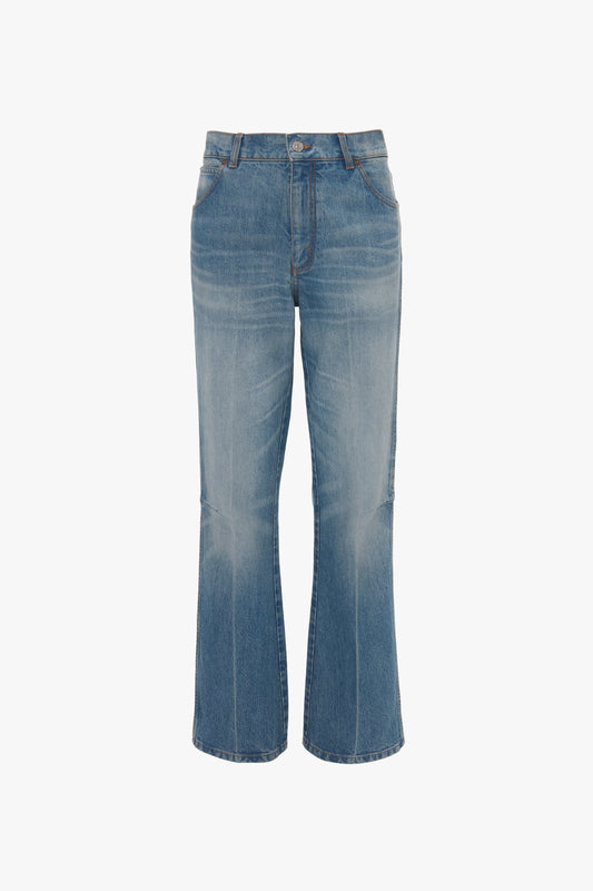 A pair of blue 100% cotton denim Victoria Beckham Relaxed Flared Jean In Broken Vintage Wash with a slight flare at the bottom, five pockets, and a button and zipper closure.