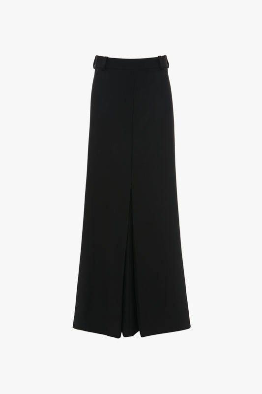 A figure-flattering, black, high-waisted, wide-leg skirt made from pure wool features a front slit and belt loops on the waistband. Introducing the Floor-Length Box Pleat Skirt In Black by Victoria Beckham.