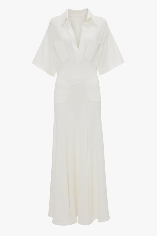 A white, short-sleeved, collared midi dress with a V-neckline and two chest pockets, exuding relaxed glamour in its lightweight knit: the Panelled Knit Dress In White by Victoria Beckham.