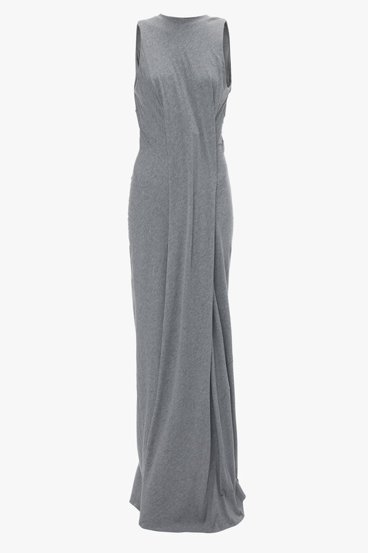 A sleeveless, floor-length Frame Detailed Maxi Dress In Titanium by Victoria Beckham with a draped design and a high neckline exudes contemporary design and an elongated silhouette.