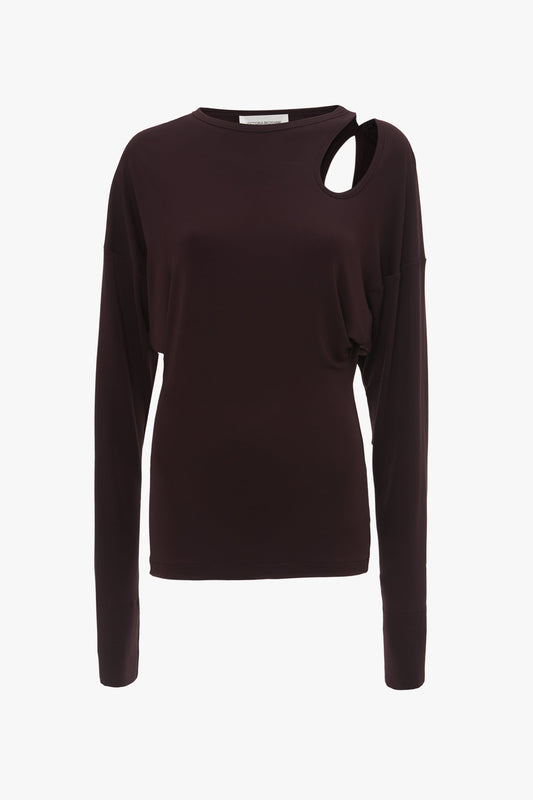 The Twist Detail Jersey Top In Deep Mahogany by Victoria Beckham with a round neckline and a circular cut-out detail on the right shoulder exudes casual sophistication.