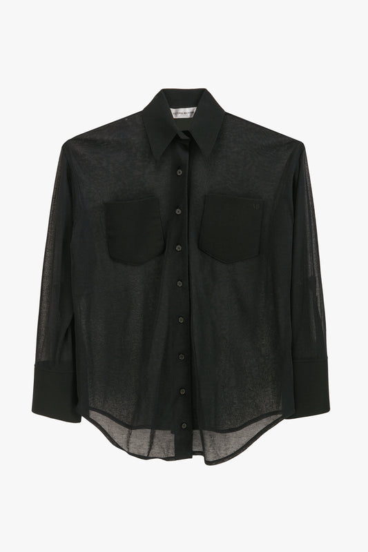 A black, long-sleeved, sheer button-up Pocket Detail Shirt In Black by Victoria Beckham with two chest pockets and a collared neckline.