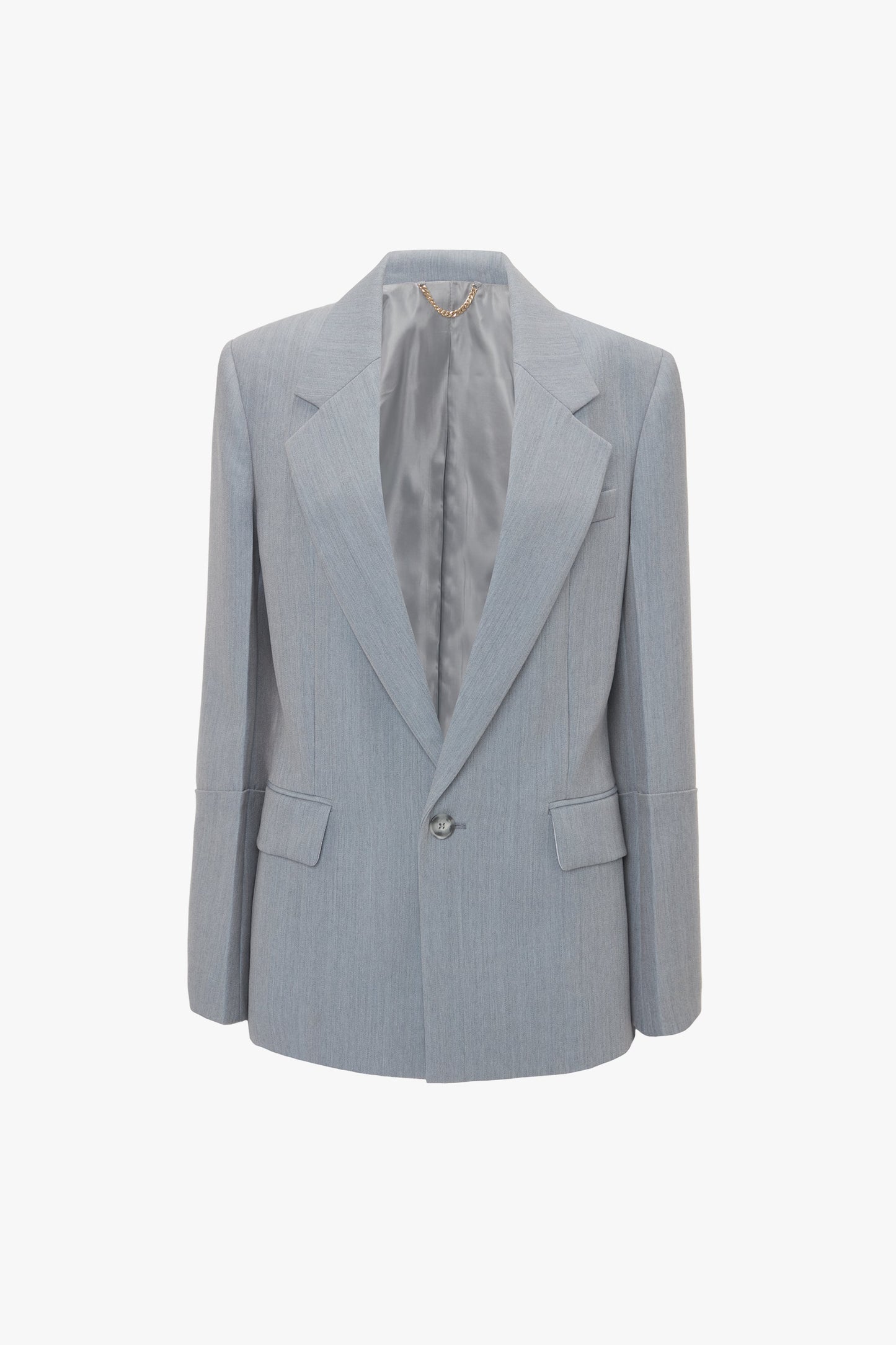 A grey single-breasted blazer with a notched lapel, contemporary detailing, front pockets, and a single button closure hanging on a white background. Product Name: Exclusive Sleeve Detail Patch Pocket Jacket In Marina Brand Name: Victoria Beckham