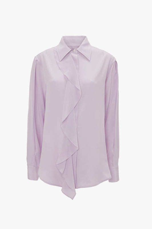 A light purple, petunia-colored Asymmetric Ruffle Blouse In Petunia by Victoria Beckham with an asymmetric ruffled front detail and a collar, offering a contemporary contrast.