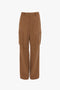 Relaxed Cargo Trouser In Tobacco by Victoria Beckham with a relaxed silhouette, multiple pockets, flat front, and a straight-leg fit, displayed against a plain white background.