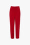 Tapered Leg Trouser In Carmine by Victoria Beckham with a straight-leg cut, traditional tailoring, and a pleated front.