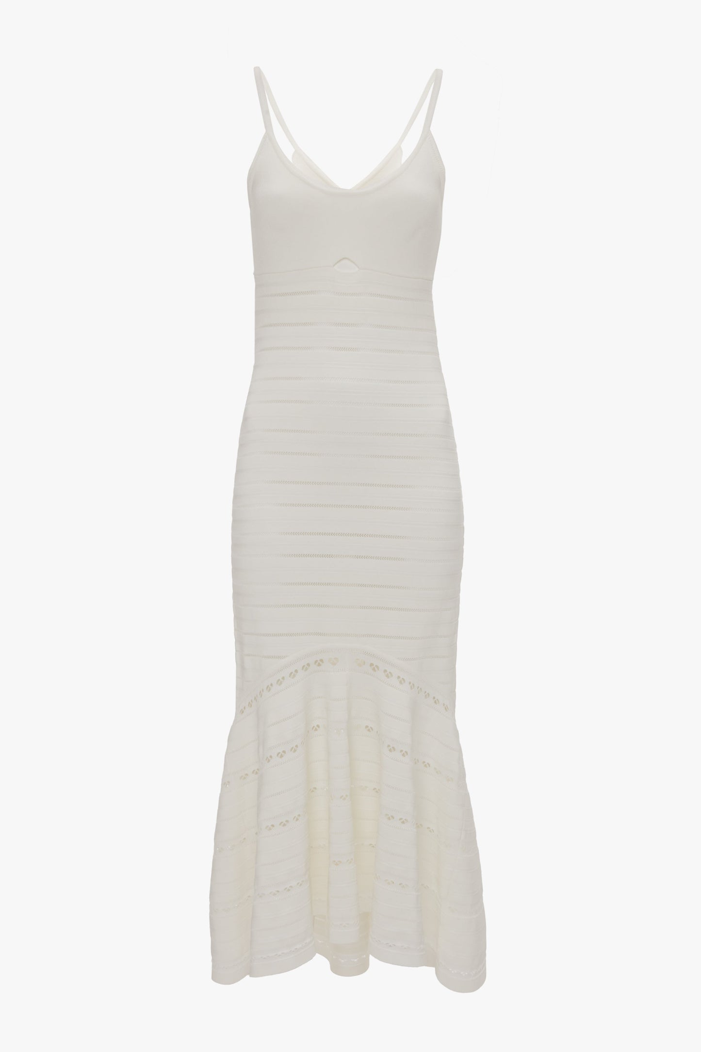 A sleeveless, fitted white dress with thin straps, featuring a flared, tiered hem and subtle cut-out details. Introducing the Cut-Out Detail Cami Dress In White by Victoria Beckham.