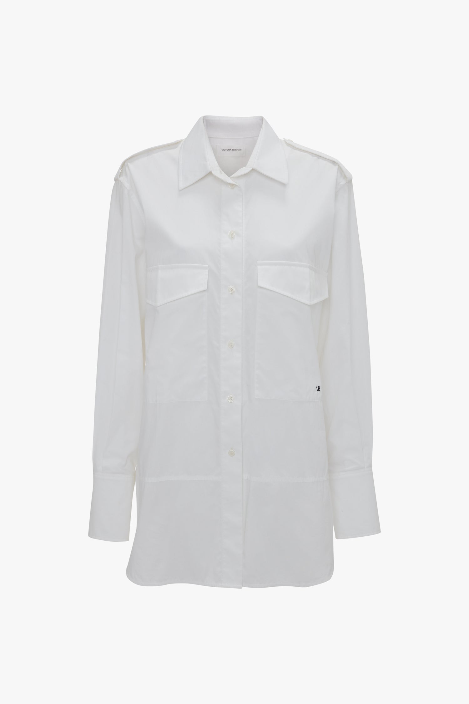 A long-sleeved white button-up Oversized Pocket Shirt In White by Victoria Beckham with two front chest pockets, crafted from organic cotton and displayed against a white background, exudes modern sophistication.