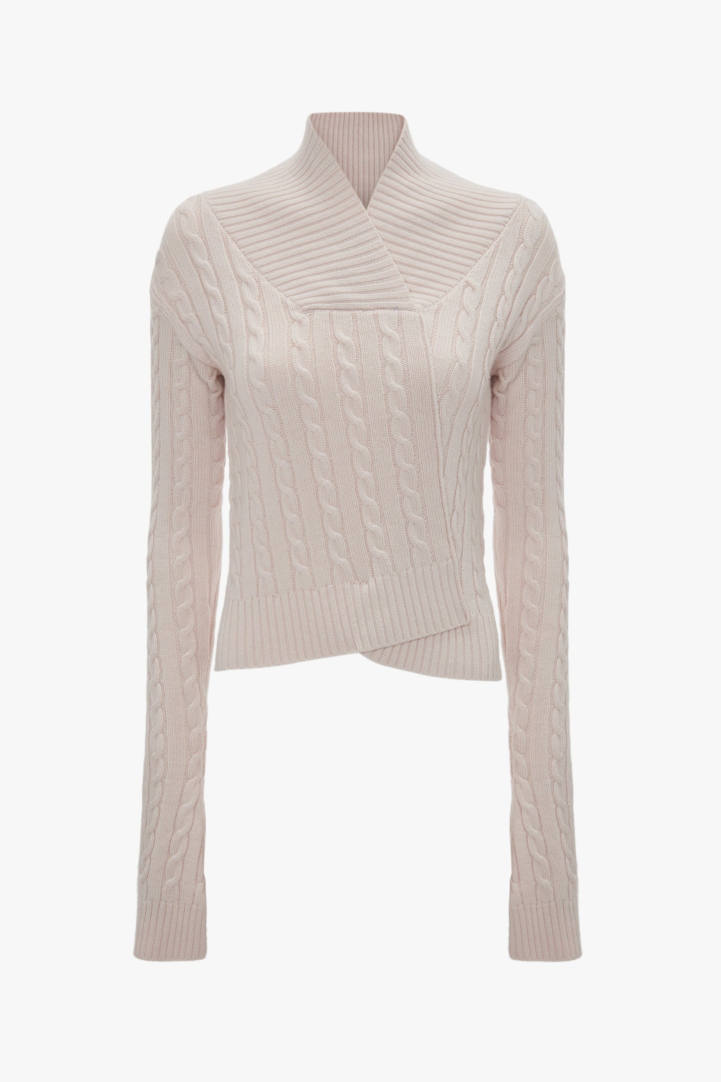 A light pink, long-sleeved, cable-knit sweater crafted from luxury merino wool with a wrap-over front and ribbed cuffs and hem from Victoria Beckham called the Wrap Detail Jumper In Bone.