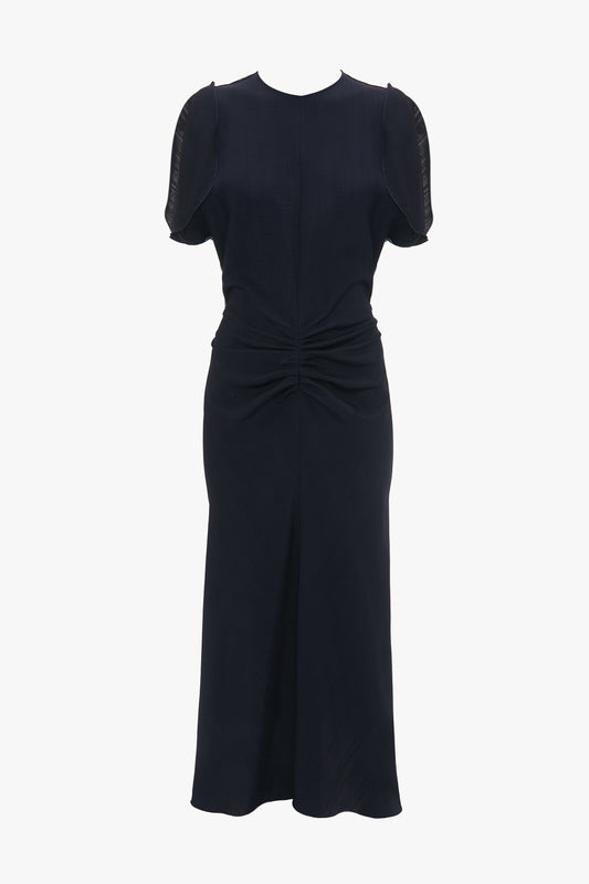 A black, Gathered V-Neck Midi Dress In Midnight by Victoria Beckham featuring a fit-and-flare silhouette with short sleeves and a slightly flared skirt, displayed on a plain white background.