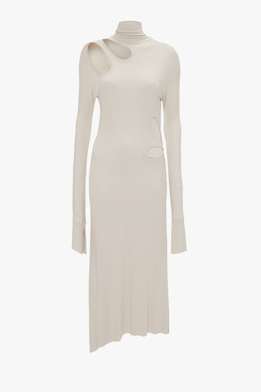 The Long Sleeve Cut-Out Jersey Midi Dress In Bone by Victoria Beckham in off-white is crafted from liquid crepe jersey, showcasing asymmetrical cutouts on the chest and shoulder. It features a high neckline and a chic asymmetric hemline for added flair.