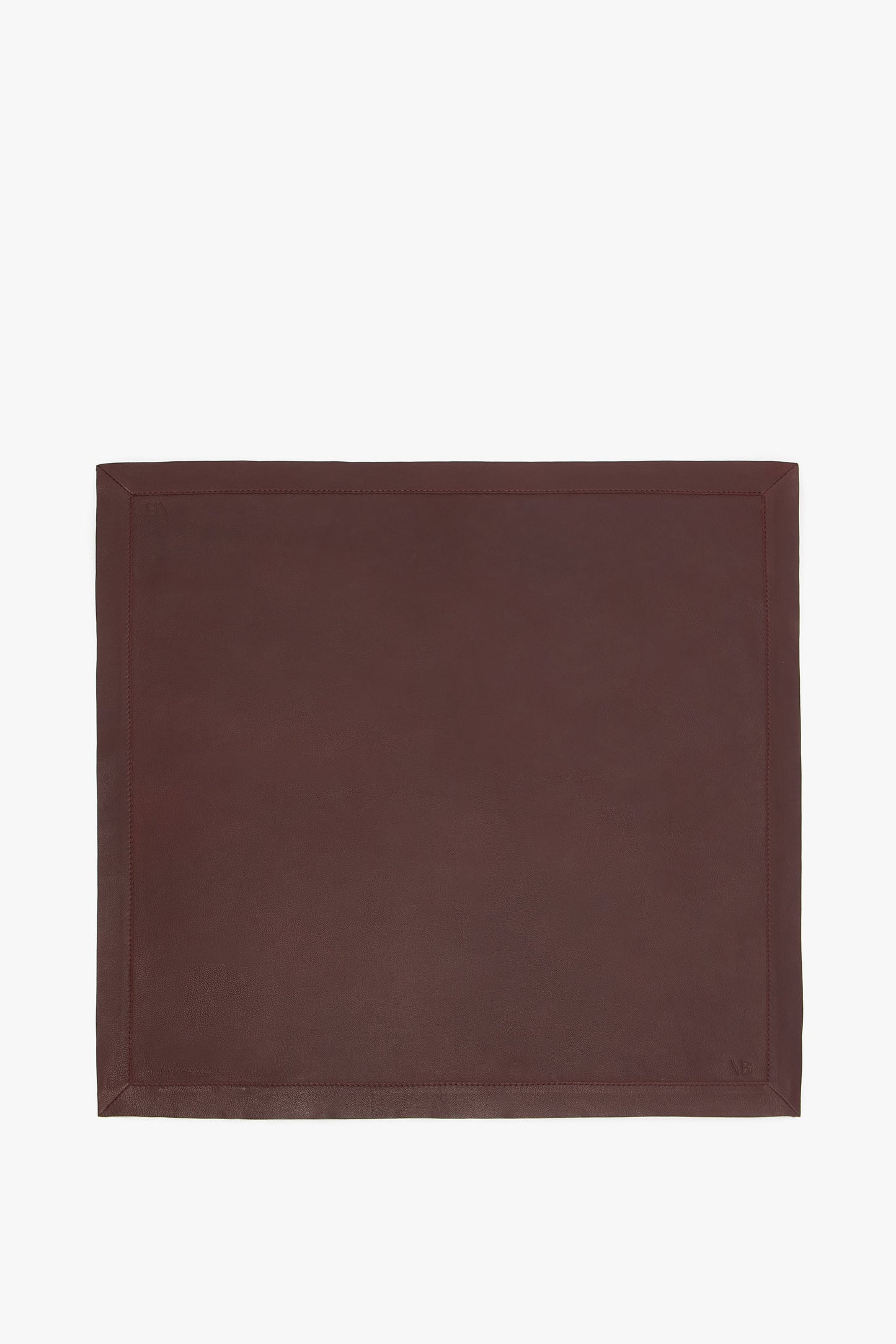 A Leather Scarf In Bordeaux by Victoria Beckham with a simple rectangular design and subtle border stitching, embodying the elegance of masculine tailoring.