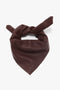 A Leather Scarf In Bordeaux with a knot, displaying a subtle "VB" logo embossed on the fabric, by Victoria Beckham.