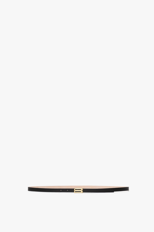 Exclusive Micro Frame Belt in Black Leather by Victoria Beckham with a gold buckle on a white background.