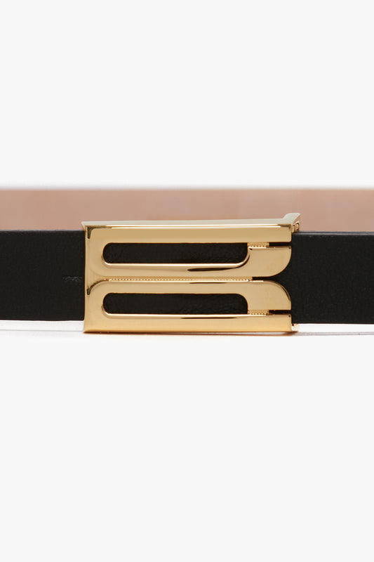 Close-up of a Victoria Beckham Exclusive Micro Frame Belt In Black Leather with a gold hardware buckle against a white background.
