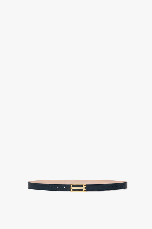 A black Frame Belt crafted from croc-embossed leather with elegant gold hardware, displayed on a white background.

Replaced: A **Frame Belt In Midnight Blue Croc Embossed Calf Leather** by **Victoria Beckham** crafted from croc-embossed leather with elegant gold hardware, displayed on a white background.