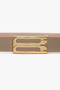 A beige leather belt with a gold frame buckle featuring a modern, rectangular design, this versatile accessory seamlessly complements any outfit. Introducing the Victoria Beckham Exclusive Frame Belt In Beige Leather.