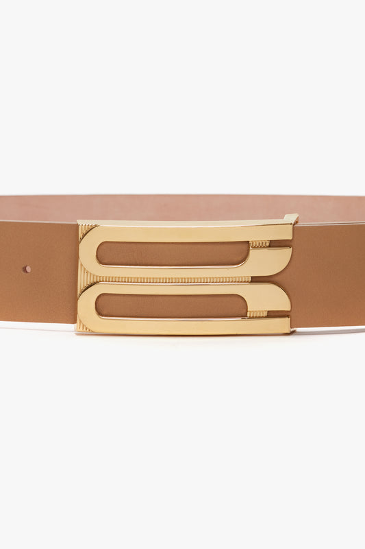 A brown calf leather belt with gold hardware and a sleek Victoria Beckham Jumbo Frame Belt In Camel Leather buckle.